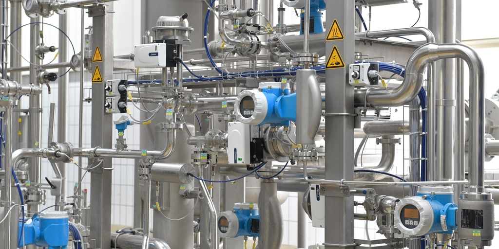 Several flow devices in a beverage manufacturing facility.