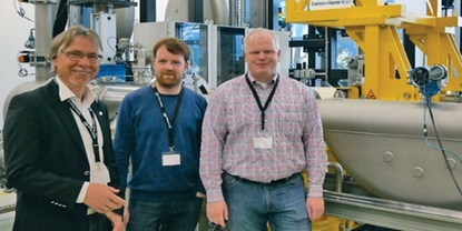 Picture of customers Wintershall in front of hydrocarbon calibration rig at Endress+Hauser Flow
